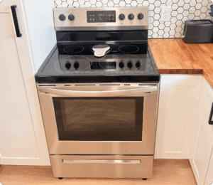 Cleaning Residential Stove In Kitchen